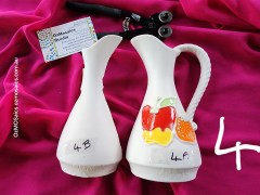 Halved ceramic pitchers 4B and 4F on pink fabric with tile nippers – OzMosaics Studio